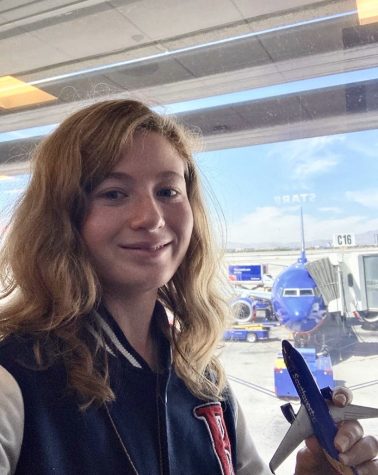 FLIGHT FANATIC: Marissa Forte (20) holds a replica Southwest aircraft in the Southwest terminal at OCs John Wayne airport. Forte indulges her passion for flight by watching and photographing aircraft taking off and landing at Southern California airports. 