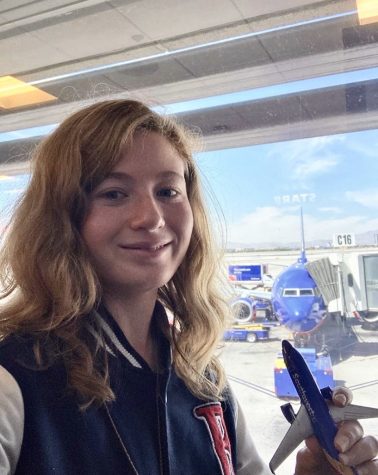 FLIGHT FANATIC: Marissa Forte ('20) holds a replica Southwest aircraft in the Southwest terminal at OC's John Wayne airport. Forte indulges her passion for flight by watching and photographing aircraft taking off and landing at Southern California airports. 