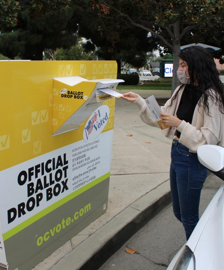 A Brea resident deposits their early voting ballot into an official ballot drop box in Brea on Oct. 25. On the ballot is Proposition 18 which, if passed, will allow 17-year olds to vote in election years. 
