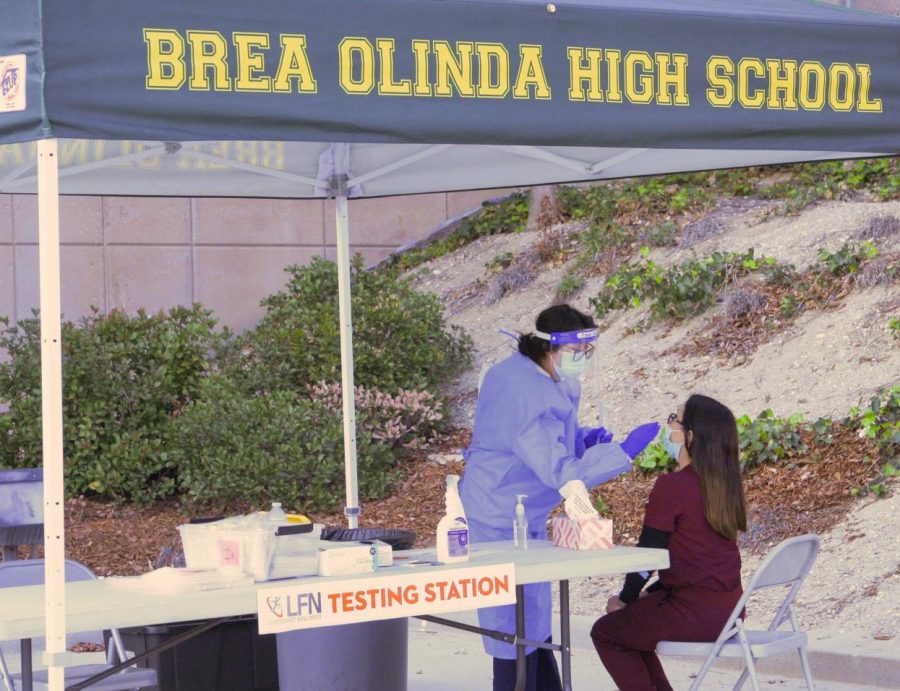 A nurse gets tested at BOHSs testing clinic. The clinic is set up through a partnership between BOHS and Living Fit Nation and will be on campus until the last day of school.