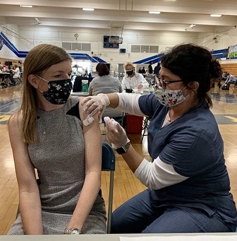 Natalie Deporto, BOUSD nurse, administers a vaccine to a Placentia Yorba Linda Unified School teacher. When COVID-19 vaccines became available to education and childcare workers, Deporto was trained to administer vaccines. 