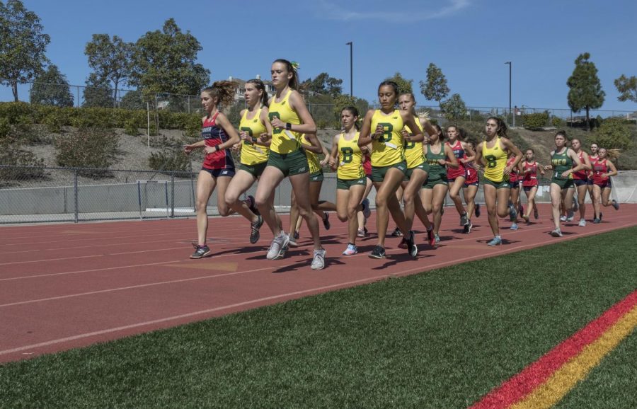 Varsity girls cross country sprints ahead against Yorba Linda High School in their last dual meet of the pandemic-shortened season on March 6. The girls varsity program finished 2-2 for the Spring.