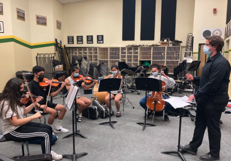 Kenneth Taber, band director, conducts the Chamber Orchestra practicing “Harry’s Wondrous World” at the final after school rehearsal on Tuesday. The Pops Concert will be this Friday, 6 p.m. in the quad. 