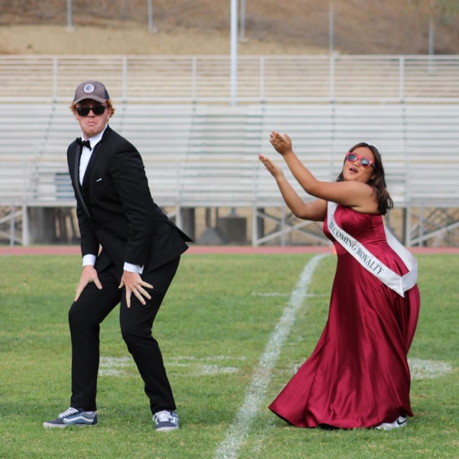 Phil McWade and Homecoming Princess Brooklyn Mercado, seniors, perform a dance routine at the Sept. 17