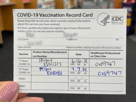 A BOHS student holds their vaccination card. California Governor Gavin Newsom announced on Oct. 1 that all public and private schools will be expected to mandate COVID-19 vaccinations on a still-to-be-determined date in 2022. 