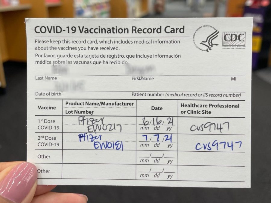A+BOHS+student+holds+their+vaccination+card.+California+Governor+Gavin+Newsom+announced+on+Oct.+1+that+all+public+and+private+schools+will+be+expected+to+mandate+COVID-19+vaccinations+on+a+still-to-be-determined+date+in+2022.+