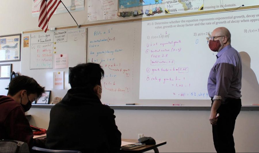 Matthew Finnerty, math teacher, teaches a lesson on exponential growth and decay to his fourth period Algebra II/Trig. class. A Western Association of Schools and Colleges (WASC) visiting committee will enter classrooms on Feb. 28 as part of their review of BOHSs six-year action plan.