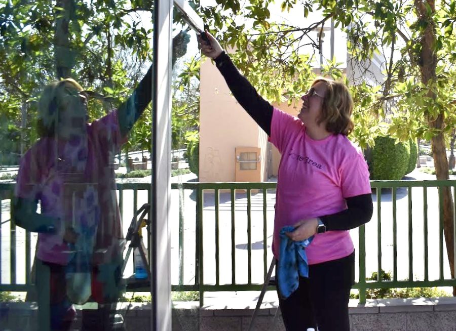 Patti Chiles, Love Brea volunteer, cleans windows at one of Love Brea's sites, Brea Olinda High School. Over 300 volunteers served the city of Brea to complete a total of 21 projects.