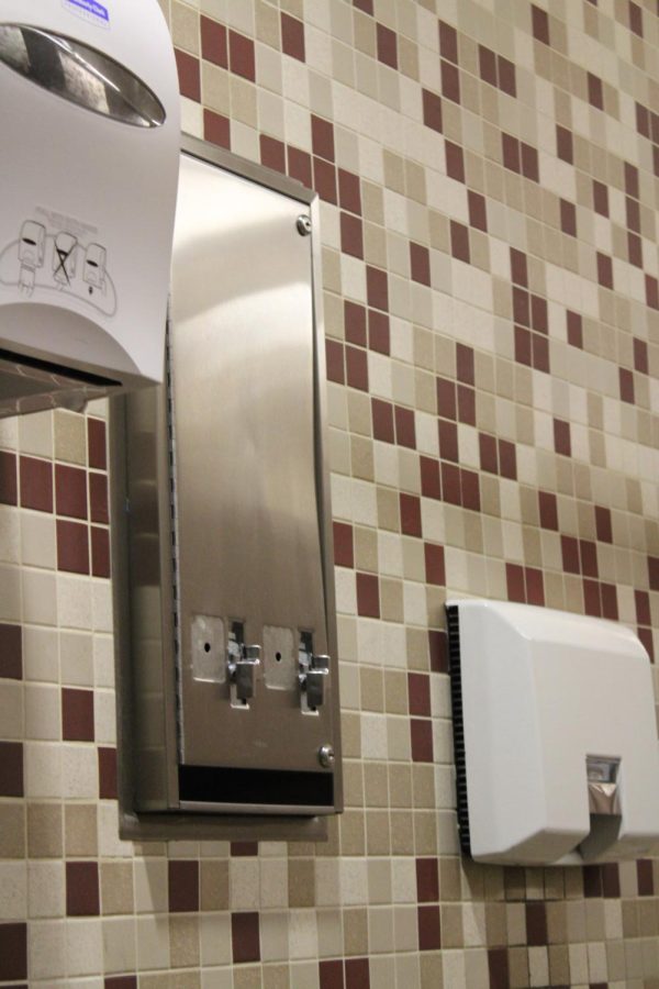 In girls bathrooms, metal dispensers that once required coins remains empty. Once the Menstrual Equity Act goes into effect, new dispensers will be fully stocked with menstrual products, free-of-cost.