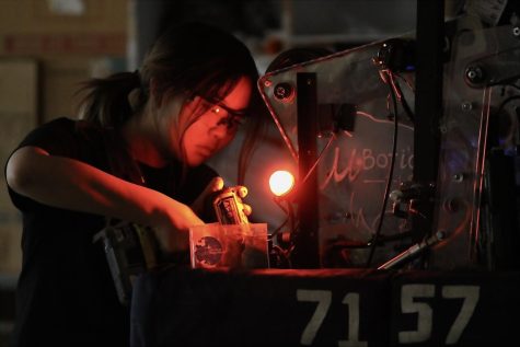 Clara Lee, senior and Mubotics president, works on Washington, the robot that competed, and placed sixth, at the National Championships in Houston in April. The Mubotics program was founded in 2018, and applies math and science to create competition robots.