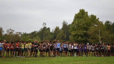 The boys cross country team prepares to compete at the 30th annual Brea Invitational on Oct. 1. The course featured nature trails and a redwood forest that made the meet unique. 