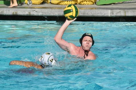Philip McWade, senior and varsity captain, passes the ball to his team mate in a game against the Yorba Linda High School boys water polo team. BOHS made it to the second round of CIF.