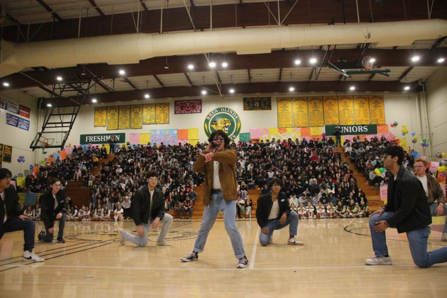 Micheal Galentine, a Mr. Brea contestant, strikes a pose to the crowd as he and the other Mr. Brea contestants perform a choreography to a mash up of many hit songs. This year’s winter rally showcased other performances by BOHS Cheer, Dance Production, Show Choir, and more.