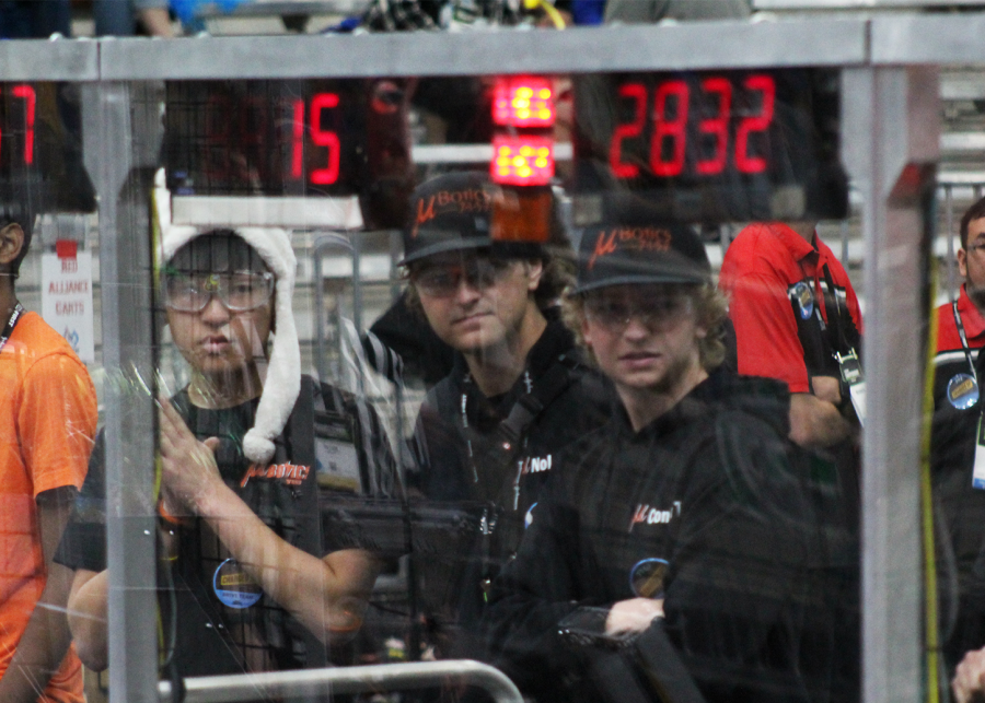 (left to right): Aaron Yoon, sophomore, Nolan Nicassio, senior, and Connor Tracey, senior, stand in the driver’s station. Each round consists of 15 seconds of “autonomous” (the robot runs solely on programming), followed by two minutes and 15 seconds of the drive team operating the robot.