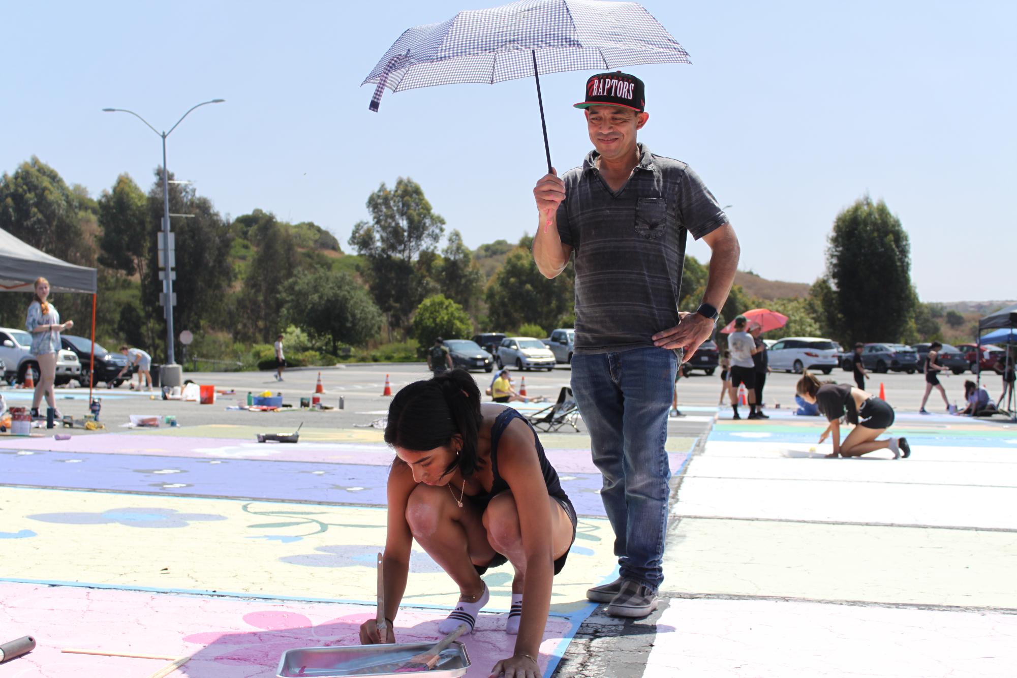 Seniors Get Colorful at Annual Parking Lot Painting – The Wildcat