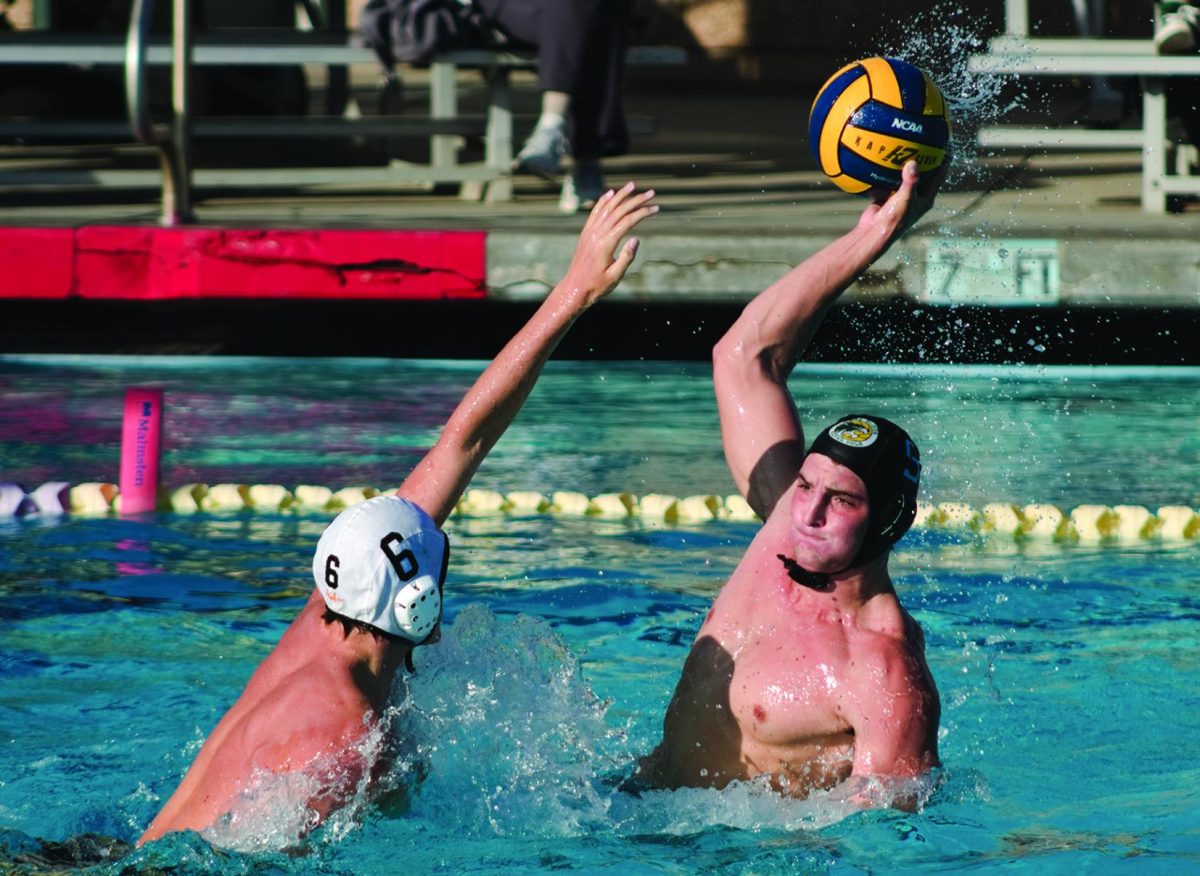 Russ+DiCesaris%2C+junior%2C+shoots+over+a+Foothill+defender+on+Oct.+24.+Varsity+water+polo+opened+CIF-Southern+Section+Division+2+playoffs+with+a+17-9+win+over+visiting+Rancho+Cucamonga%2C+then+fell+to+Dos+Pueblos+High+School%2C+13-10%2C+on+Nov.+2.