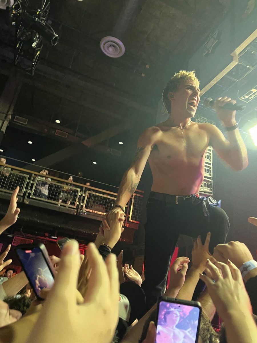 Bad Suns lead singer, Christo Bowman, steps off-stage and into the hands of fans at the bands House of Blues show on Nov. 17. The L.A.-native band was in town to promote their latest EP, Infinite Joy.