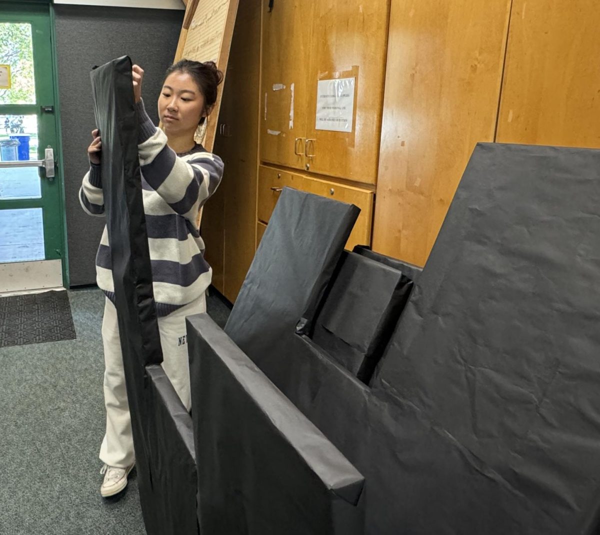 Yeaun Kim, senior, assembles a piece of the NYC-inspired skyline that will decorate the winter semi-formal dance venue. BOHSs first winter dance in 14 years will take place on Feb 3.