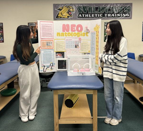 Eugenie Kim (left) and Christine Kim (right) rehearse their health career display presentation on neonatologists. The two qualified to compete in the State Leadership Conference which will take place April 4 to 6 in Anaheim.