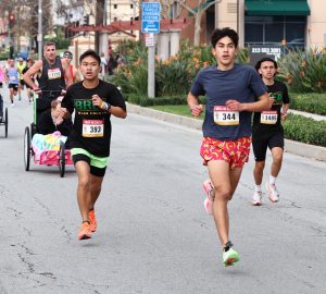 BOHS juniors Branden Pineda and Zander Ramirez, and senior Demitri Garcia, participate in the Brea 8K Classic on Feb. 25. The annual race, organized by parent volunteers from the BOHS instrumental music, choir, and color guard booster clubs, raised $50,000 for the Wildcat Entertainment Corps and choir programs. 