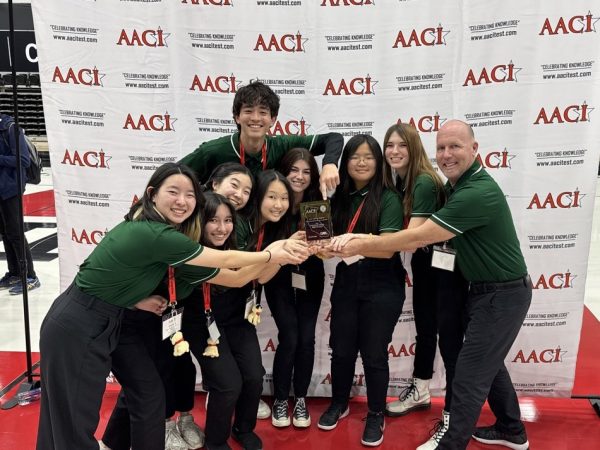 Eight National Honor Society of Sports Medicine members and adviser Ken McCall hold their third place plaque at the annual AACI Sports Medicine Competition at California State University, Northridge on March 16.