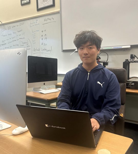 Roy Kim, senior, and his gaming laptop in the GITA room. Kim was chosen as one of 30 Edison Scholars in Southern California and received a $50,000 check during a surprise visit from the organization on March 29.
