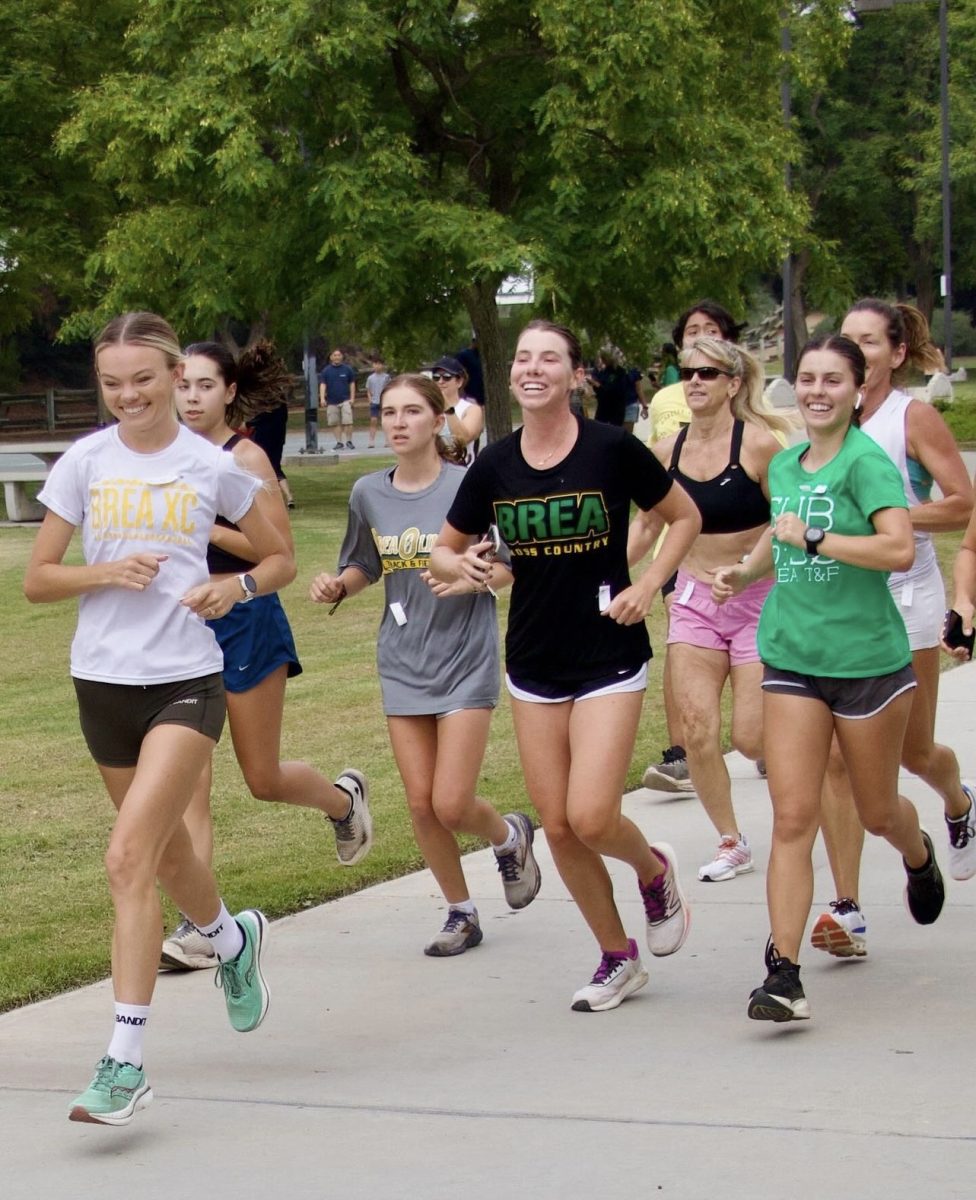 Past and present Wildcat cross country runners and coaches, including (left) Hailey Andersonn, (middle) Emily Wernli (‘22), and (right) Cassie Apahidean (‘22) participate in the annual @brearunning alumni run at Olinda Ranch Park on July 27. While long distance running has obvious physical benefits, some of the biggest benefits are mental. 