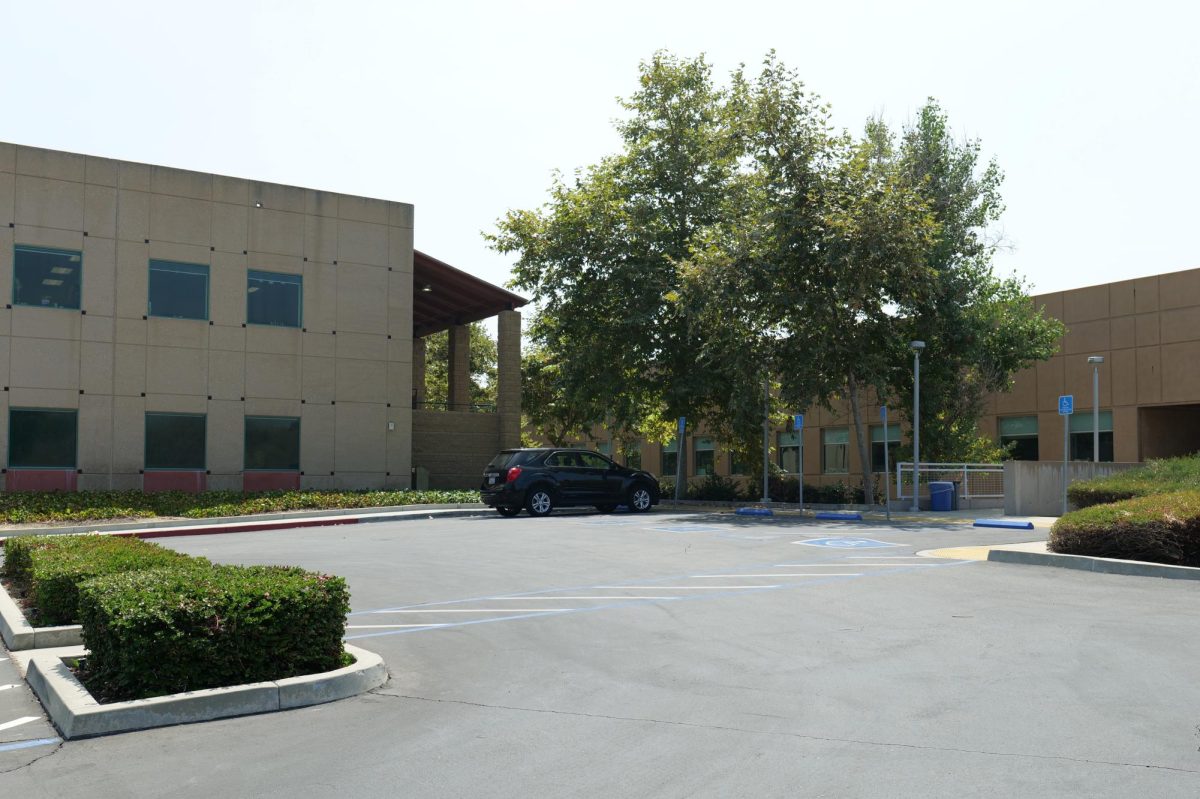 A fence and access gate will be installed between M building and the parking lot north of A building. 
