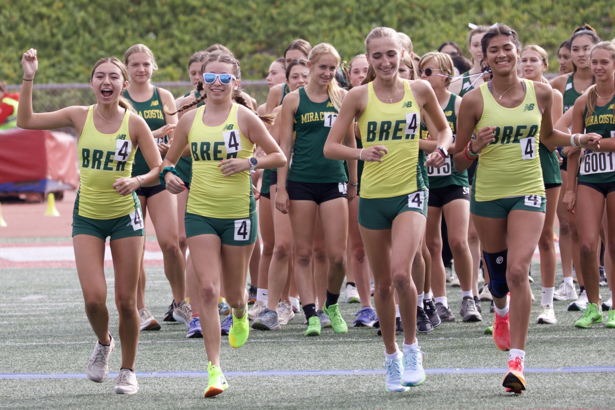 Hailee Martin ('26), Mia Luna ('26), Sarah Garrigue ('26), and Issabella Garcia ('27) at the Redondo Relays on Aug. 24. While long distance running has obvious physical benefits, some of the biggest benefits are mental, including improved sleep, less anxiety, and overall happiness. (Courtesy of Ceci Garcia)