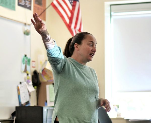 Kate Caprine, Government and U.S. History teacher, presents a lesson. Caprine strives to "present multiple perspectives and arguments from both sides of the aisle and stick to the facts" when teaching during presidential elections.