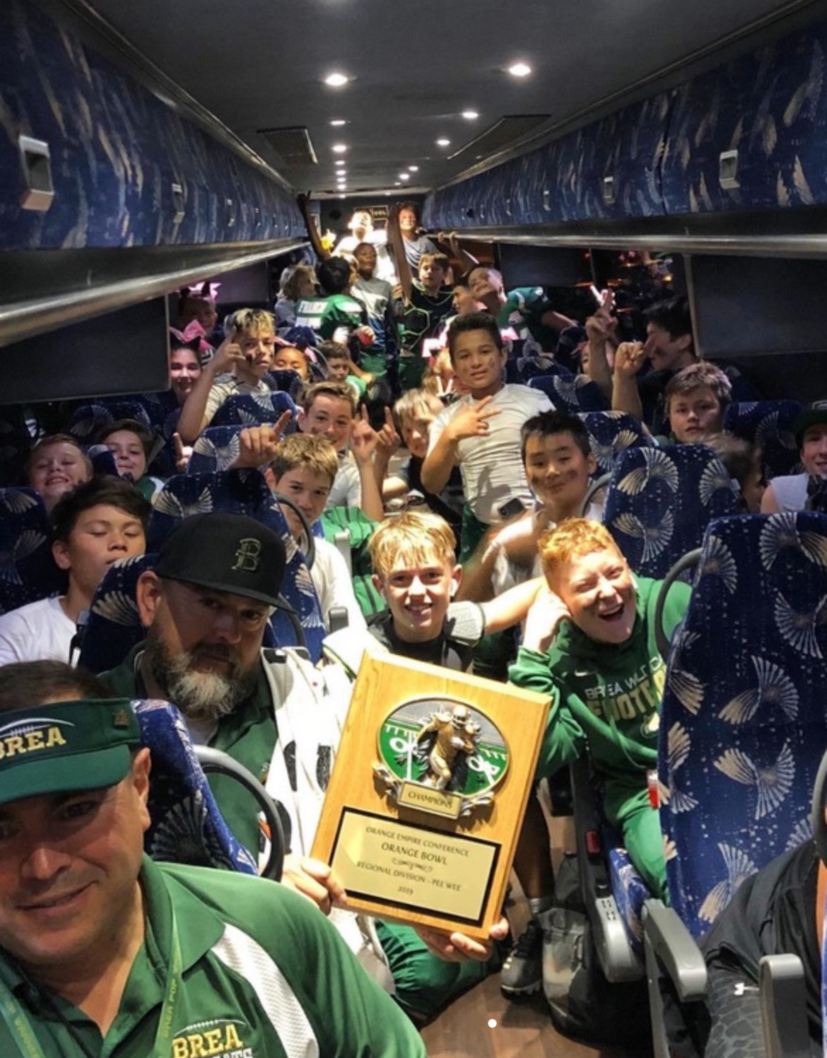 Players and coaches on the bus ride home after the 2019 Orange Bowl. Eleven Wildcats on the current varsity roster competed on the squad. (Courtesy of Kelly Mason)