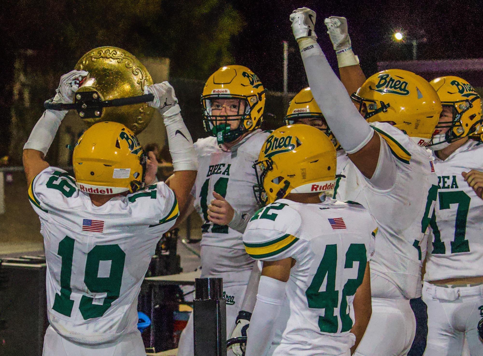 Varsity football rings the bell after Sept. 6 victory over Diamond Bar High School. 