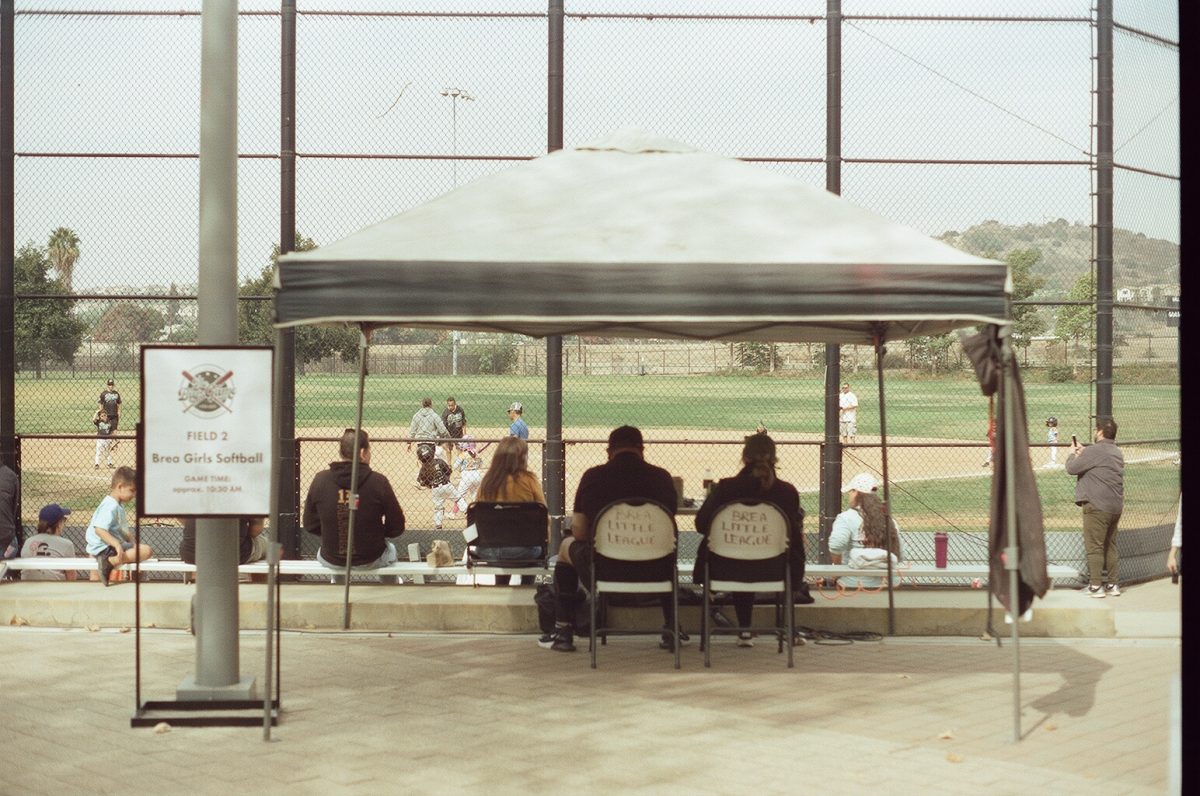 Scorekeepers and attendees at the Brea Little League exhibition game at the Brea Sports Park on Oct. 26. 