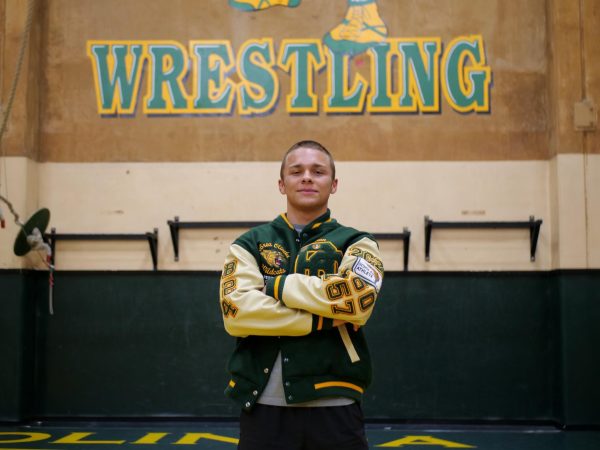 Nathan Aceves ('25) photographed in the Wildcat auxiliary gym. The two-sport varsity athlete starred in the backfield during football's record-setting season, and currently dominates on the mat for the Wildcat wrestling program.  