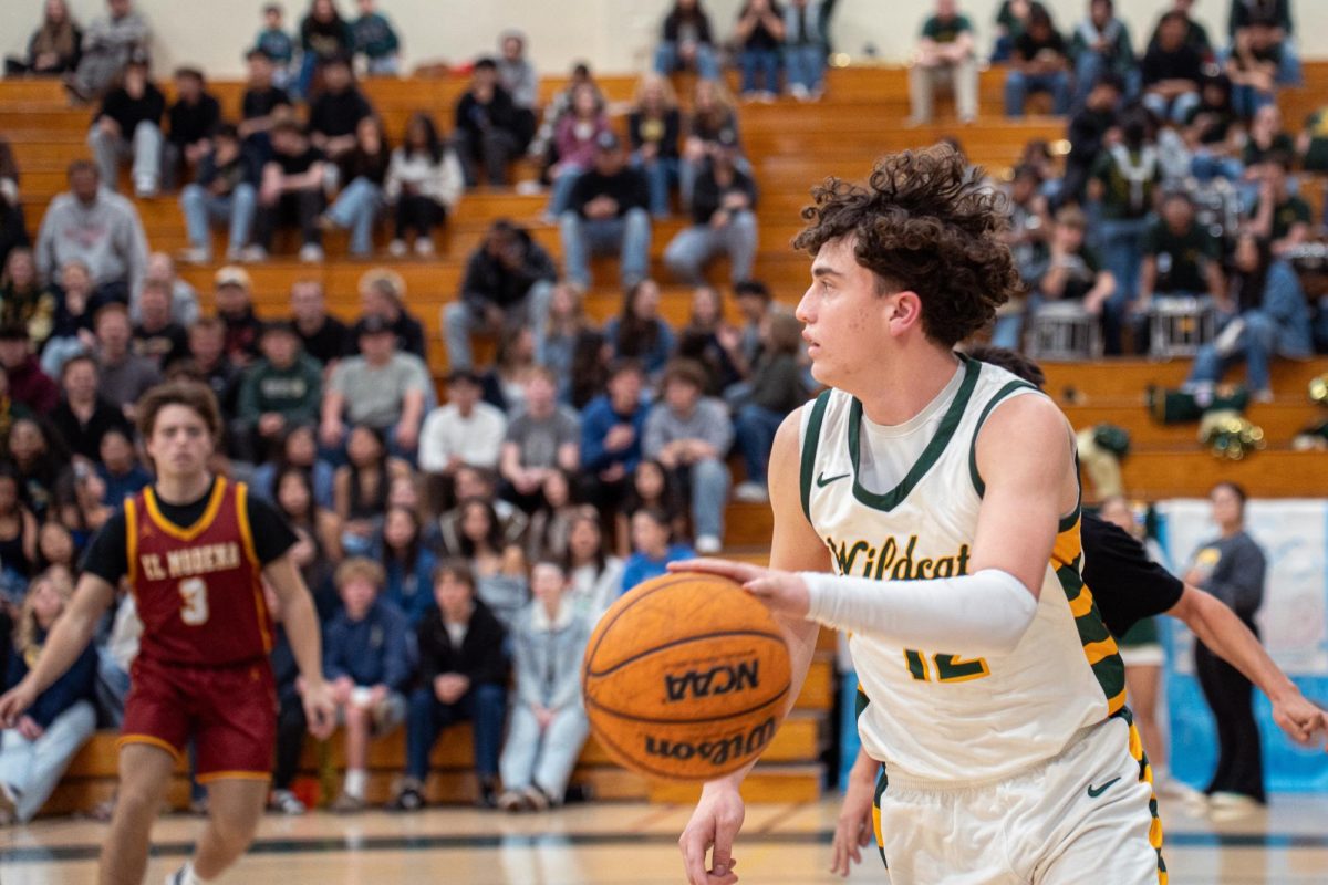 Logan Severson ('26) looks up court after an inbounds play. The junior shooting guard was just shy of a double-double with 8 points and 7 rebounds. 