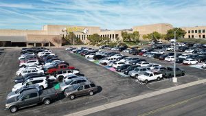 BOHS's lower parking lot on a typical weekday. Student vehicles range from sedans, pickups, SUVs, and electric- and gas-powered. 