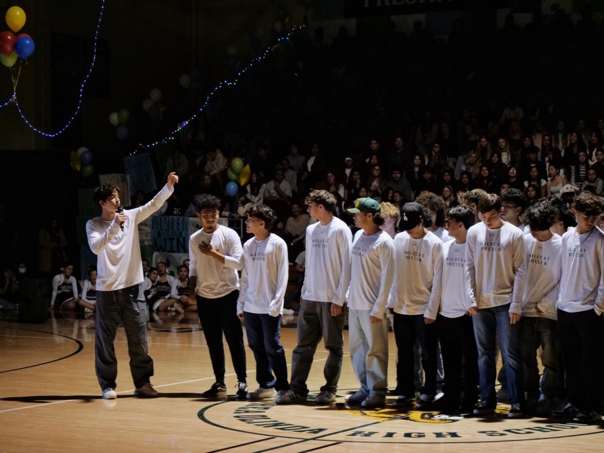 Boys' varsity soccer is introduced to the student body during the winter rally. The squad would later pay tribute to late teammate Joseph Macedo ('25).