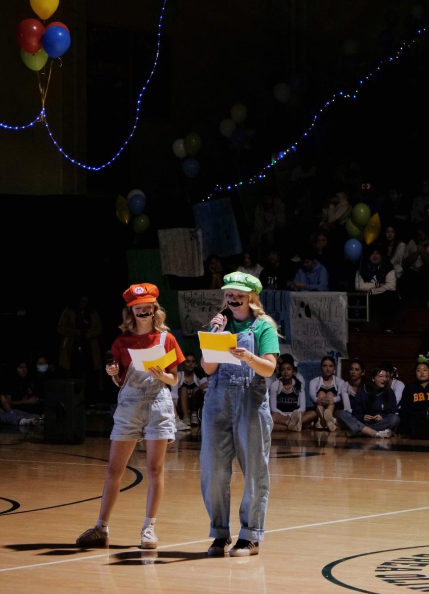 Brielle Denbo ('25) as Mario and Danica Coburn ('25) as Luigi emcee the Mario Kart-themed winter rally.