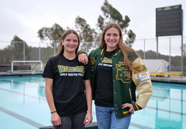 Varsity girls' water polo players Zoey ('28) and Rylee ('26) at the Wildcat pool deck. The sisters discovered the sport from their mother, Emily Flesher, who was a three-time national champion at the University of Redlands.  