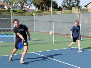 Nathan Bourgeois (‘26) and Owen Guss ('26) participate in a game of pickleball at a private Brea residential court. With the completion of Arovista Park's first phase of renovations in the fall, and continued progress with the Brea 265 expansion, the city will have multiple public pickleball courts.