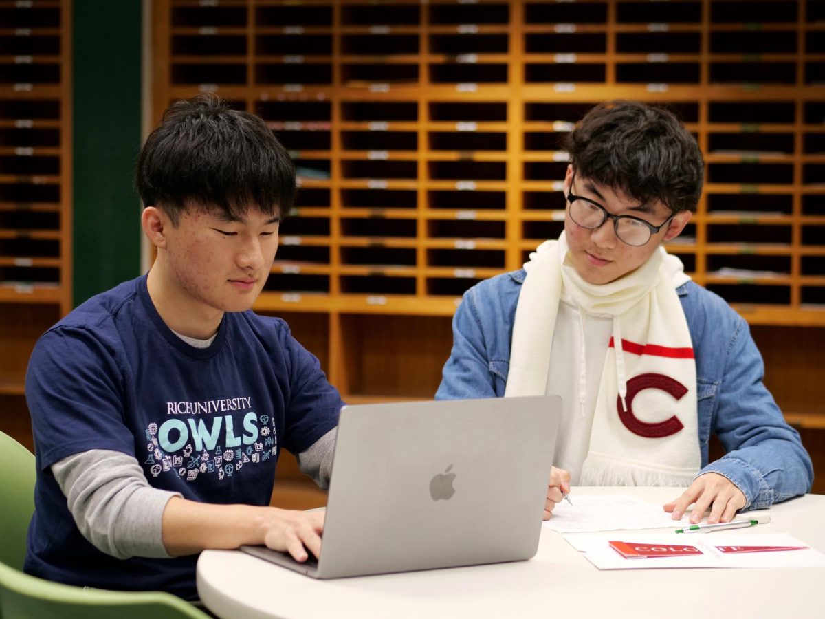 Andy and Jayden Kim ('25) in the BOHS main office. The twins earned full-ride scholarships to Rice University and Colgate University, respectively, through Questbridge National College Match.