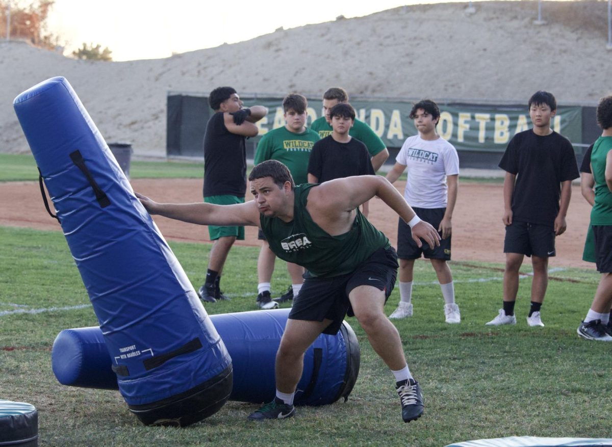 Defensive end Kasey Crader (‘26) practices blocking technique at a July 24 practice on the BOHS softball field.