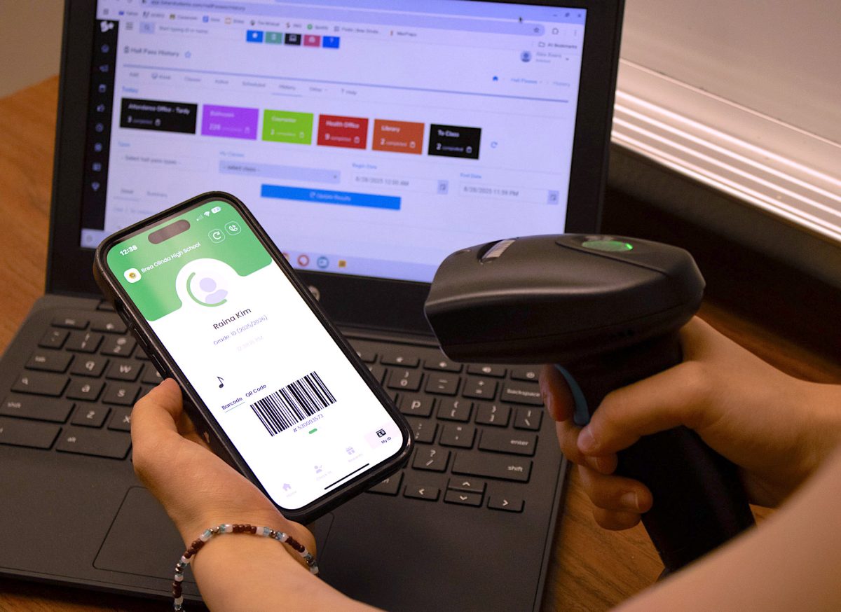 A BOHS student scans their student ID using a bar code scanner and teacher Chromebook set up to log the hall pass. According to Bryson Burns, assistant principal, the benefits of the 5-Star Students app are “safety, efficiency, and accountability.”