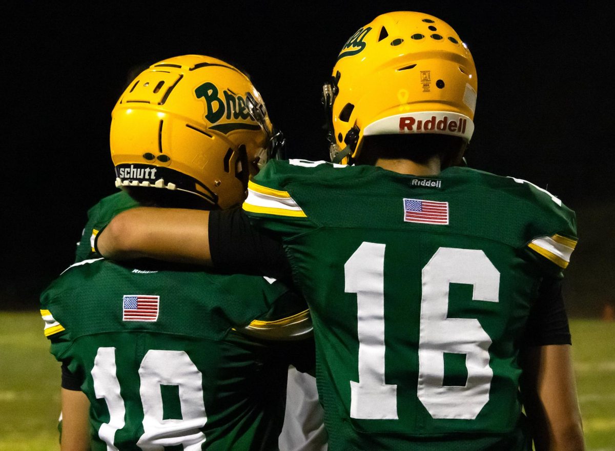 Evan Rivas Melendez ('28) and Ryan Nero ('26) watch from the sidelines as the Wildcats' varsity football team closes out its 37-7 win over visiting Diamond Bar Sept. 5.