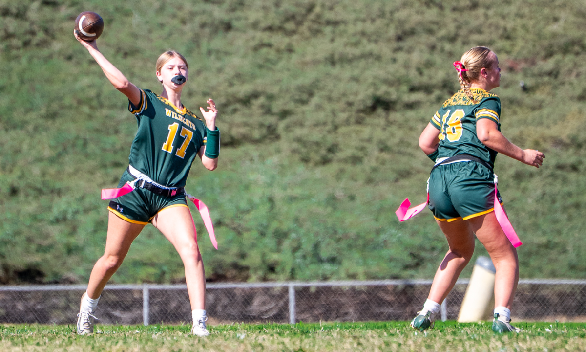 Quarterback Bella Ramirez ('28) throws upfield as Ryleigh Jones ('26) blocks. 