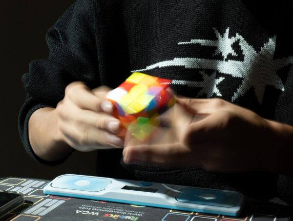 Jung executes a timed solve on a 3x3 Rubik's Cube. Jung has competed in speedcubing competitions since 2022 and ranks 37th nationally in the 3x3 event.