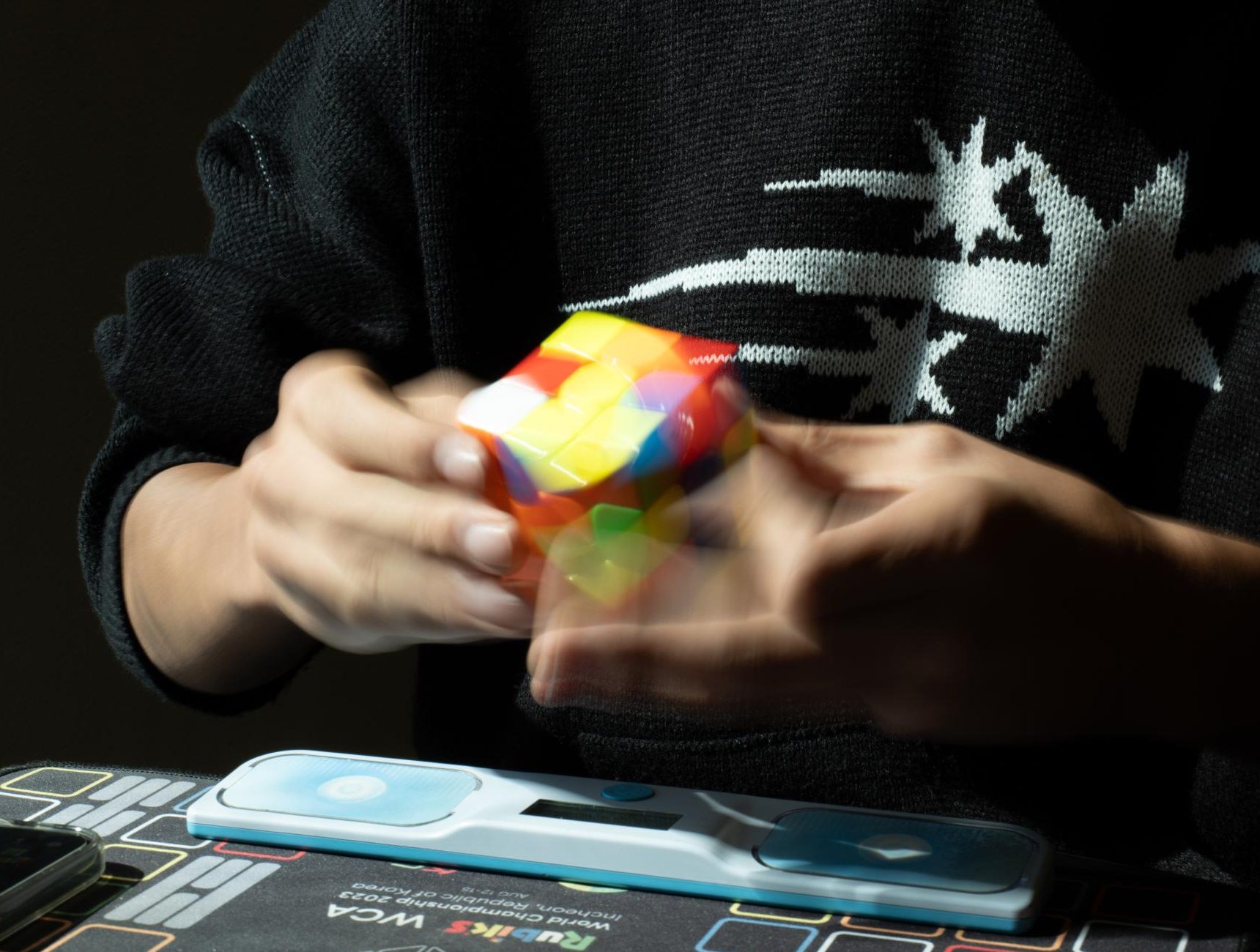 Jung executes a timed solve on a 3x3 Rubik's Cube. Jung has competed in speedcubing competitions since 2022 and ranks 37th nationally in the 3x3 event.