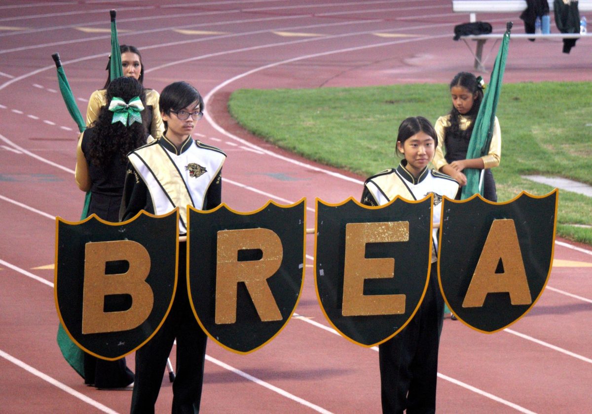Vivienne Liu (‘29) and Hugh Wong ('27) lead band in the Homecoming parade before the varsity football game Oct. 10.