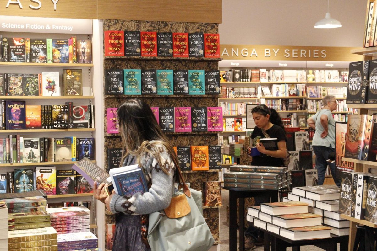 Patrons browse book shelves in the Brea Barnes & Noble.