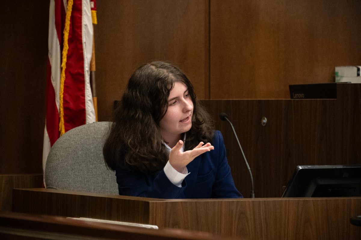 Kaitlyn Skiles (‘27) plays the role of Alden Mitchell, a witness to the events of the crime, and points to the opposing counsel table, where the defendant is sitting, identifying them as the person she is testifying about.